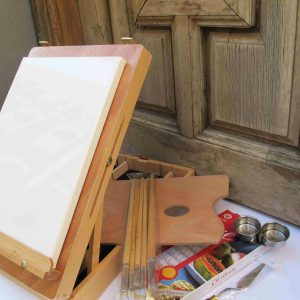 Caja caballete de madera con pintura al óleo y otros accesorios